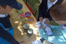 production of badges for children with the populair logo